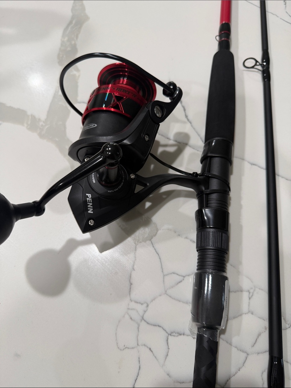 Red & Black Spinning Reel - Reliable Fishing Performance